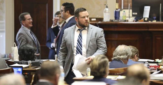 South Carolina Rep. RJ May, R-West Columbia, walks down the aisle of the House on Tuesday, March 14, 2023, in Columbia, South Carolina. (AP Photo/Jeffrey Collins)