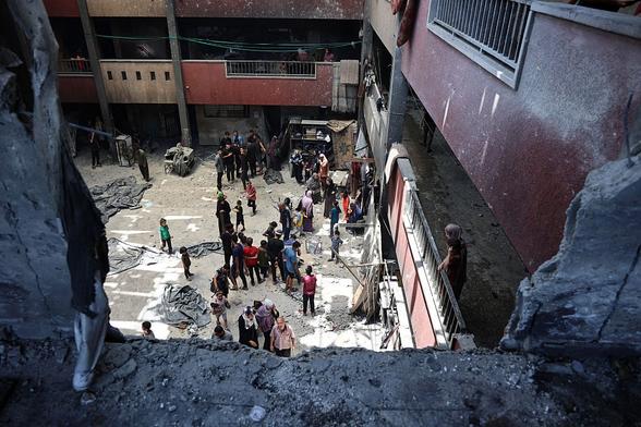 Top view of a destroyed school building that is now being used for shelter.