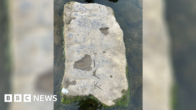 A stepping stone with the word 'Patrick' engraved into it