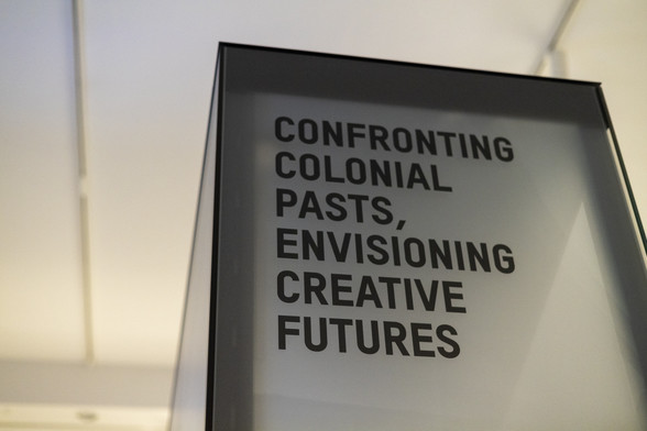 Text in Berlin's Humboldt Forum saying "Confronting colonial pasts, envisioning creative futures." 